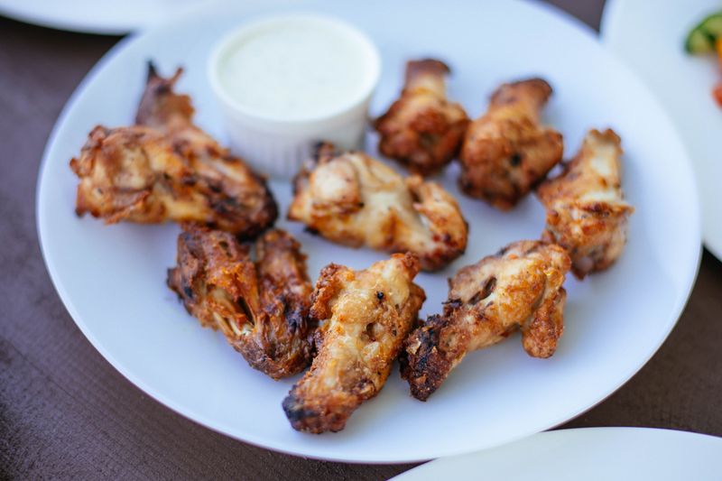 Crispy Chicken Tenders — wings over hand-breaded classic